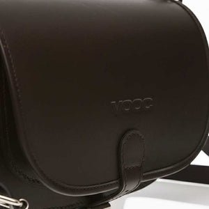 Black women's leather bag handcrafted from natural juchta leather with a sleek flap and adjustable strap