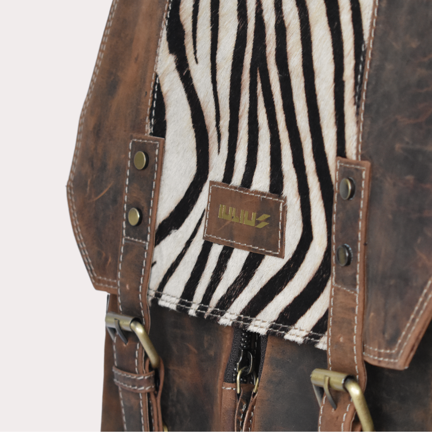 Handcrafted vintage brown leather backpack with brass buckles