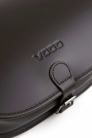 Close-up of dark brown VOOC Vintage P27 Postbag made from natural juchta leather with stitched detailing and buckle closure