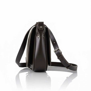 Side view of VOOC Vintage P27 Postbag in dark natural juchta leather with adjustable shoulder strap