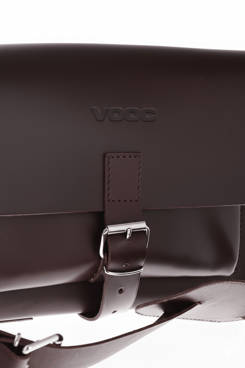 Natural leather shoulder purse with traditional buckle closure and adjustable strap in dark brown vintage style