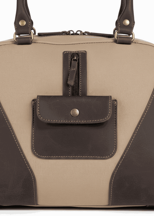 Tiara Canvas Shoulder Bag beige with dark leather accents and front pockets close-up