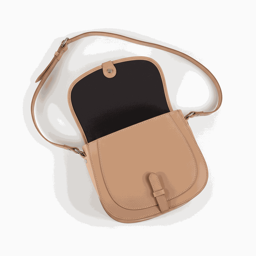 tan leather postbag with adjustable shoulder strap and flap closure, open showing interior compartments