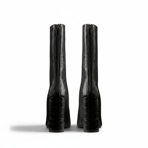 A black faux crocodile leather mid-calf boot with a pointed toe and block heel, photographed on a white background.