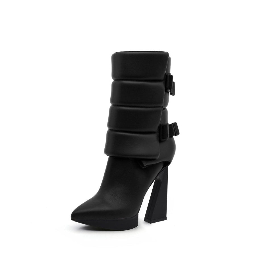 A black puffy vegan leather platform boot with adjustable straps and geometric high heel, photographed on a white background.