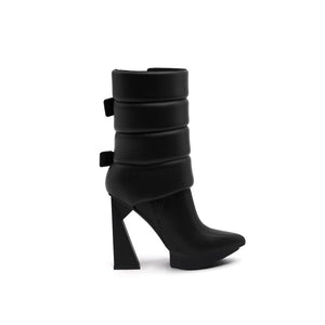 A black puffy vegan leather platform boot with adjustable straps and geometric high heel, photographed on a white background.