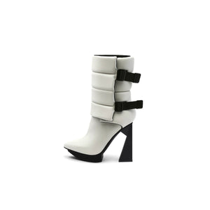 A black puffy vegan leather platform boot with adjustable straps and geometric high heel, photographed on a white background.