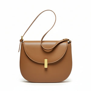 Discover the CherryMax Saddle Leather Crossbody Bag – crafted from premium cowhide leather with gold hardware and adjustable strap for timeless everyday elegance.