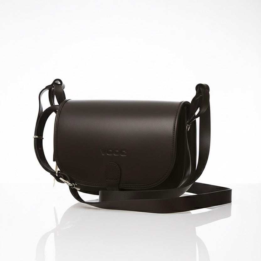 Black women's leather bag with flap closure and adjustable shoulder strap, handcrafted from premium natural leather.
