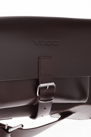 Natural leather shoulder purse with traditional buckle closure and adjustable strap in dark brown vintage style