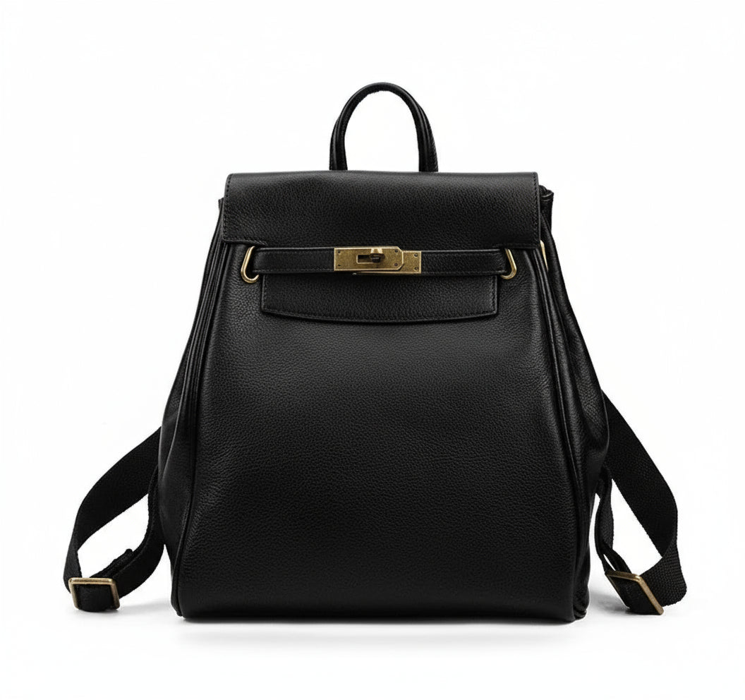 A black vintage leather backpack with gold hardware and a top handle, featuring a flap padlock closure and adjustable straps, photographed on a white background.