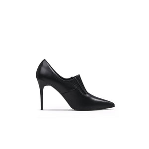A black leather stiletto heel with a pointed toe and elastic upper detail, photographed on a white background.