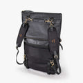 A black convertible eco-leather backpack purse with gold hardware and adjustable straps, photographed on a white background.