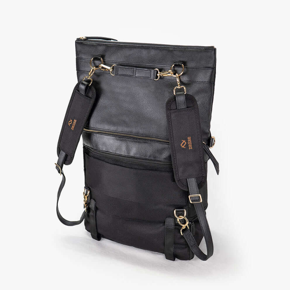 A black convertible eco-leather backpack purse with gold hardware and adjustable straps, photographed on a white background.