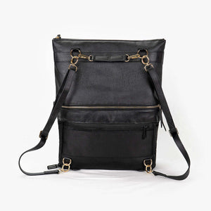 A black convertible eco-leather backpack purse with gold hardware and adjustable straps, photographed on a white background.