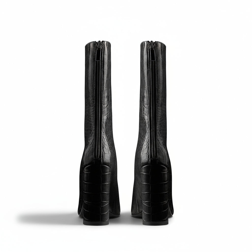A black faux crocodile leather mid-calf boot with a pointed toe and block heel, photographed on a white background.