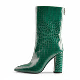 A black faux crocodile leather mid-calf boot with a pointed toe and block heel, photographed on a white background.