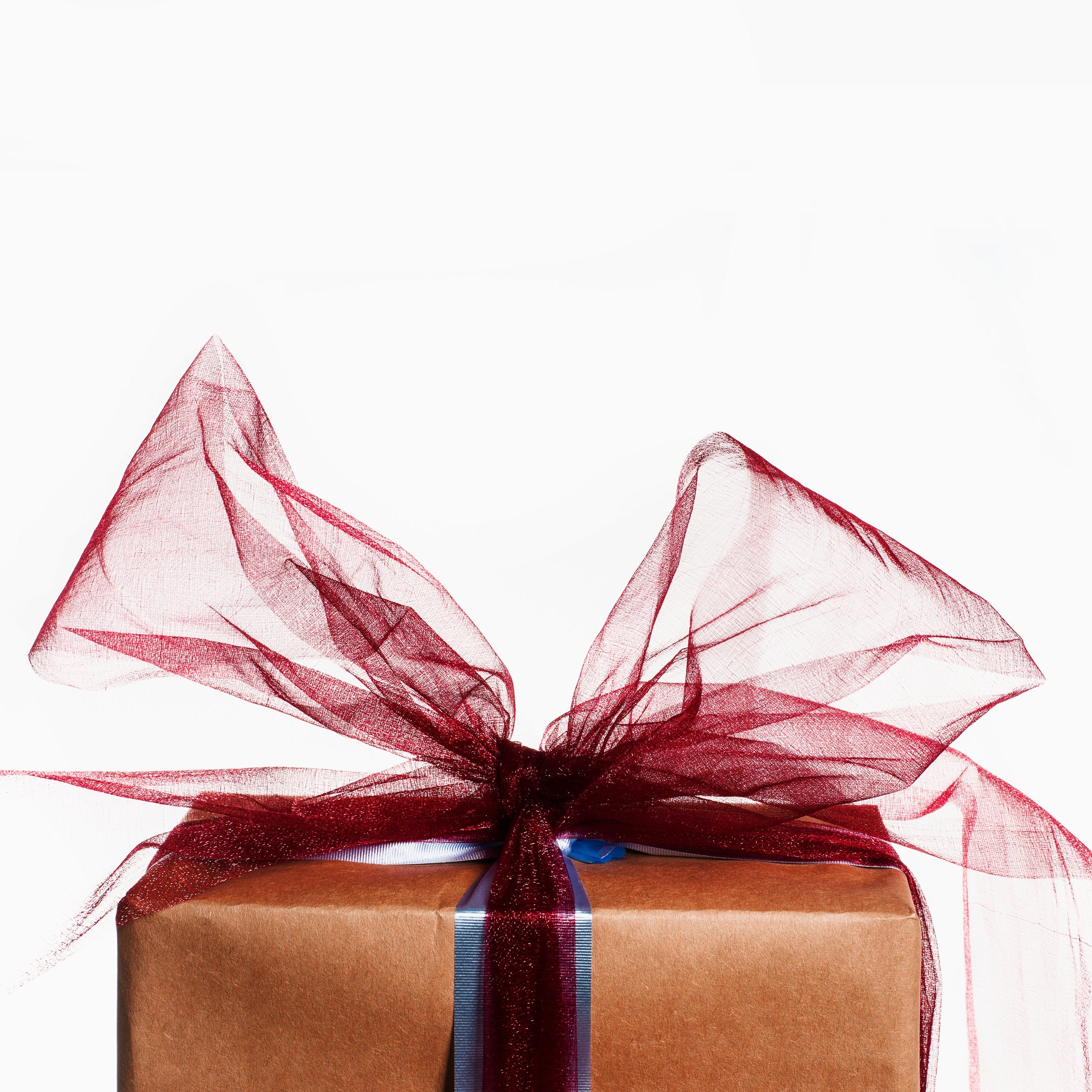 Gift box with a red ribbon on a white background