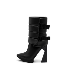 A black puffy vegan leather platform boot with adjustable straps and geometric high heel, photographed on a white background.