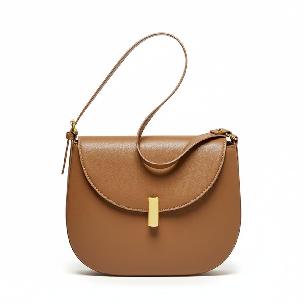 Discover the CherryMax Saddle Leather Crossbody Bag – crafted from premium cowhide leather with gold hardware and adjustable strap for timeless everyday elegance.