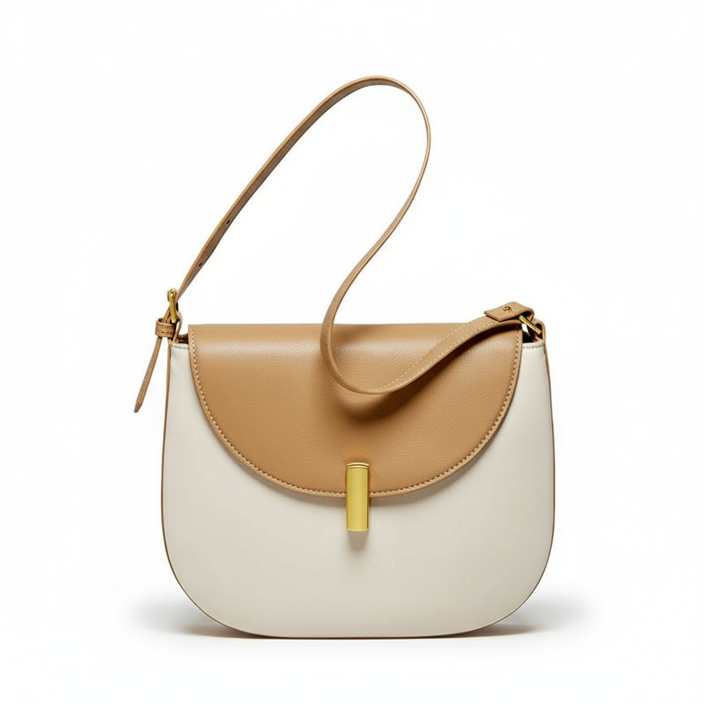 Discover the CherryMax Saddle Leather Crossbody Bag – crafted from premium cowhide leather with gold hardware and adjustable strap for timeless everyday elegance.