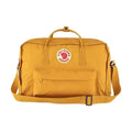 Model wearing yellow Fjällräven Kånken as backpack and shoulder bag